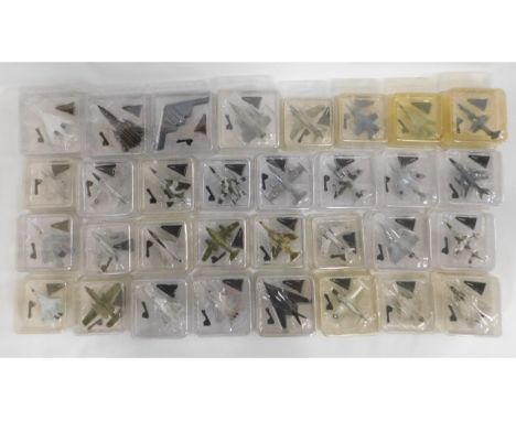 Thirty two 1:100 scale diecast jet aircraft with mounts in original blister packs