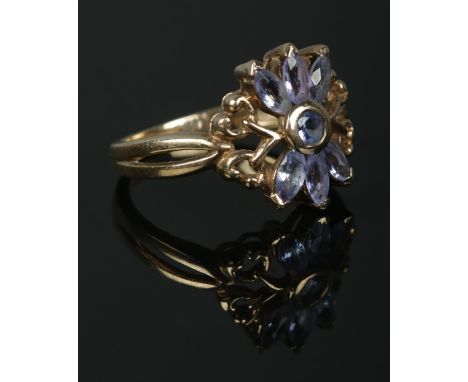 A 9ct Gold Tanzanite floral ring, set with six stones. Stamped 375 and GTV for Gems TV to the inside of the band. Size N. Tot