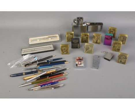 A collection of pens and lighters to include Zippo, Parker, Bohai, etc.