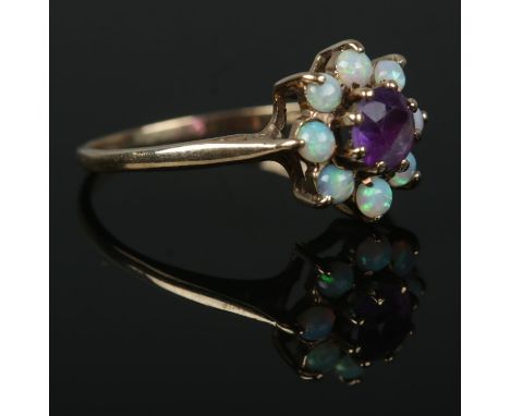 A 9ct gold opal and amethyst cluster ring, Size M½. Total weight: 1.6g.
