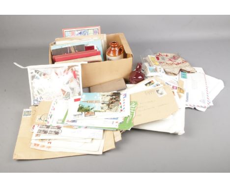 A large quantity of stamps from around the world including Mint GB stamps, other collectables including cigarette cards, ciga