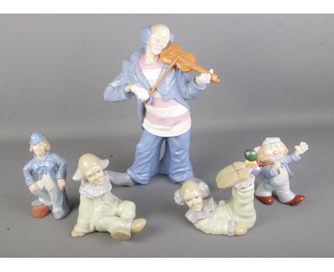 A collection of ceramic figures of clowns