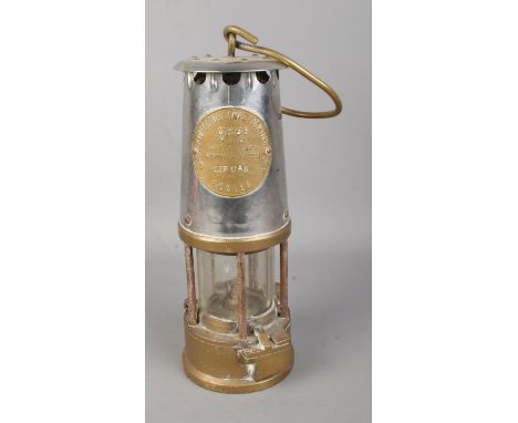 An Eccles Type GR6S miners safety lamp by the Protector Lamp and Lighting Co. Ltd. Stamped Depman.