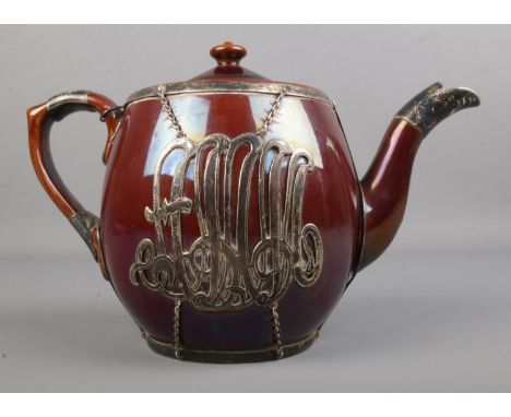 A Victorian silver overlay ceramic teapot with large applied monogram to front