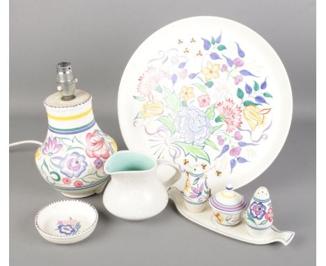 A collection of Poole ceramics. Includes charger (diameter 31.5cm), cruet set, table lamp etc.