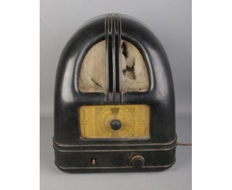 A Philco model 444 Peoples Radio receiver in black bakelite case. Untested, missing one button and speaker cover is damaged.
