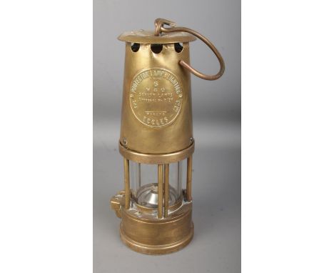 An Eccles Type 6 brass miner's safety lamp by the Protector Lamp and Lighting Co. Ltd.