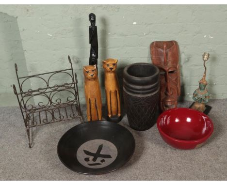 A box of oriental and tribal collectables including large wooden carved floor vase, mask, pair of carved lioness, buddha lamp