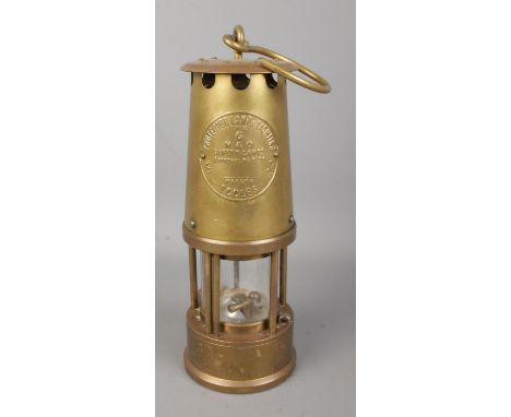 An Eccles type 6 brass miners safety lamp by the Protector Lamp and Lighting Co. Ltd.