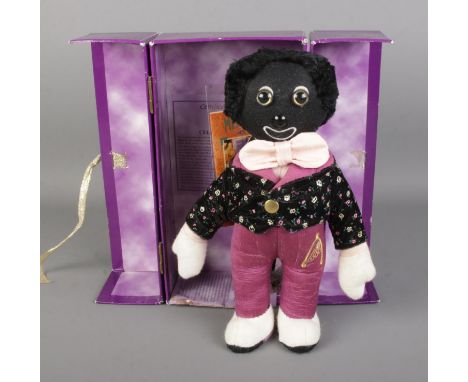 A limited edition Merrythought Millennium Golly in presentation box designed by Jacqueline Revitt. Number 435 of 2000. Notice