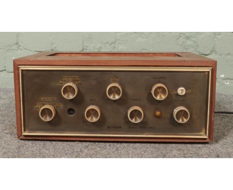A Rogers HG88 MkII valve amplifier in case. Top of case is exposed. Lights up when plugged in and turned on.