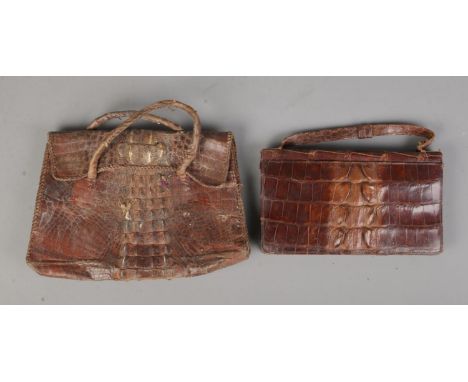 Two vintage ladies snakeskin purses, one featuring internal compact mirror.