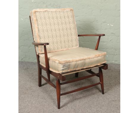 An Ercol spindle back arm chair.