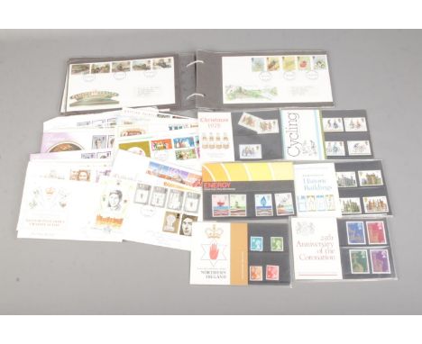 A collection of assorted stamp presentation packs along with assorted first day covers to include Historic Buildings, The Roy