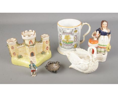 A collection of antique ceramics including a Staffordshire figure of a girl with bird, a Staffordshire figure of a castle, sw