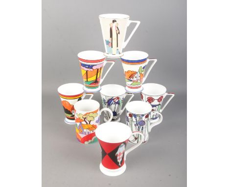 Nine art deco style ceramic cups, produced by Wren and Past Times depicting Clarice Cliff and Mackintosh inspired designs.