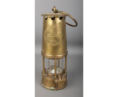 An Eccles Type 6 brass miner's safety lamp by the Protector Lamp &amp; Lighting Co. Ltd.