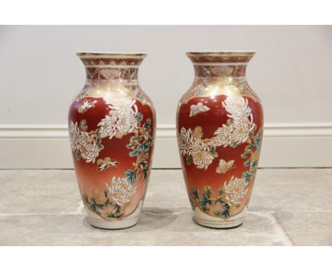 A pair of Japanese Satsuma lamp bases, 20th century, each of baluster form and decorated with reserves of red and extensive g