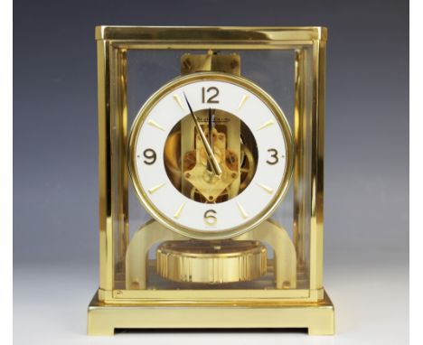 A Jaeger-LeCoultre Atmos clock, serial number 265713, the white enamel bezel applied with gilt metal Arabic numerals punctuat