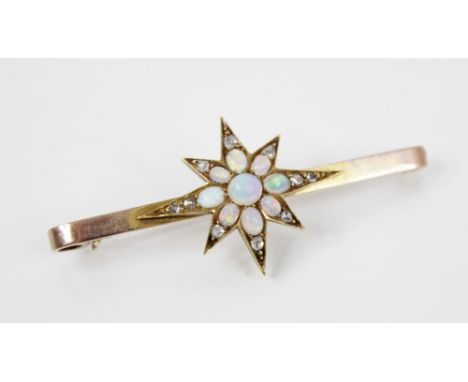 A Victorian opal and diamond starburst bar brooch, the central gold coloured starburst set with polished opal cabochons and r