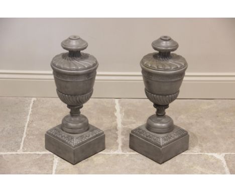 A pair of painted hardwood lamp bases, late 20th century, in the form of classical urns, each carved with nulled and wrythen 