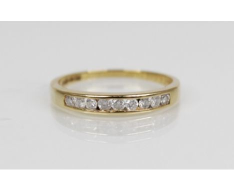 An 18ct gold diamond set half-eternity ring, comprising nine round brilliant cut diamonds, total (estimated diamond weight 0.