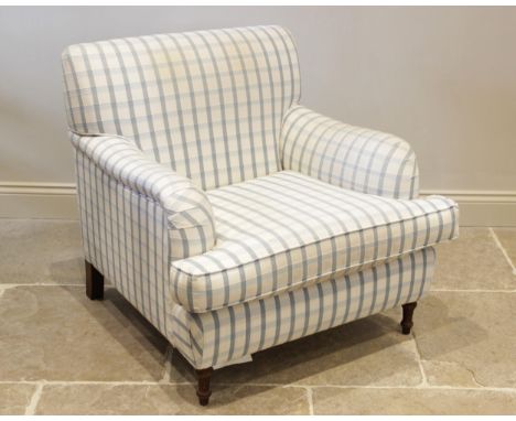 A Victorian style armchair, late 20th century, in blue check fabric, with a fitted deep set cushion seat, raised upon turned 