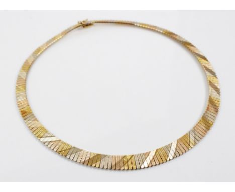 An 18ct three-colour gold collarette, comprising alternating sections of rose gold, yellow gold and white gold graduated frin