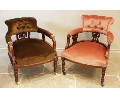 A Victorian walnut and upholstered tub chair, the shaped button back upon three carved openwork splats, above the sprung bowf