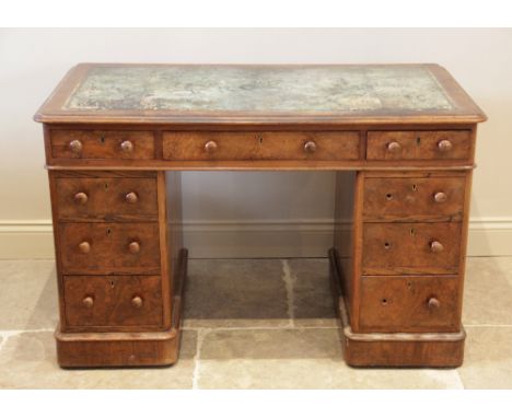 A Victorian figured walnut twin pedestal desk, the rectangular thumb moulded top with rounded corners and inset leather skive