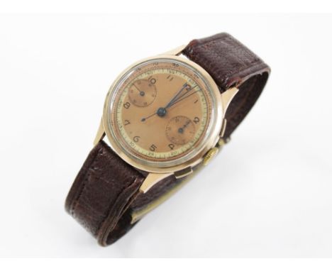 A Gentleman's 18ct gold vintage chronograph wristwatch, the circular copper dial with Arabic numerals and subsidiary dials to