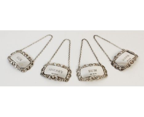 Four silver decanter labels, William Adams Ltd, Birmingham 1977-89, each of rectangular form with shell and gadroon borders, 