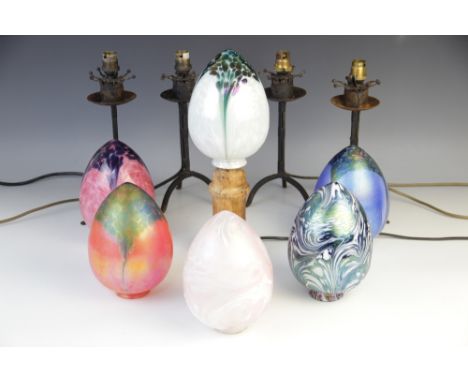 A collection of six lustre coloured glass lamp shades, each of egg form, various colours and designs to include mottled and m