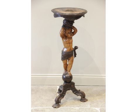 An Italian stained and carved hardwood cherub figural pedestal table, late 19th/early 20th century, the circular moulded top 