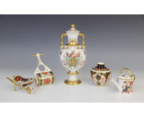 A Royal Crown Derby porcelain twin-handled vase and cover, 20th century, of inverted baluster form with knopped stem and spre