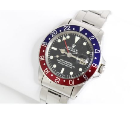 A Rolex Oyster Perpetual Date GMT Master stainless steel chronometer wristwatch, the circular black dial with luminous baton 
