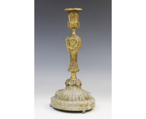 A Louis XVI style ormolu candlestick, early 19th century circa 1820, the flared sconce with continuous acanthus leaf frieze a
