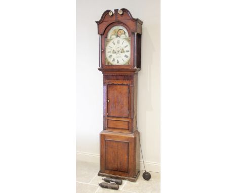 An early 19th century oak and mahogany cross banded eight day longcase clock by J Edwards Corwen, the 36cm painted break arch