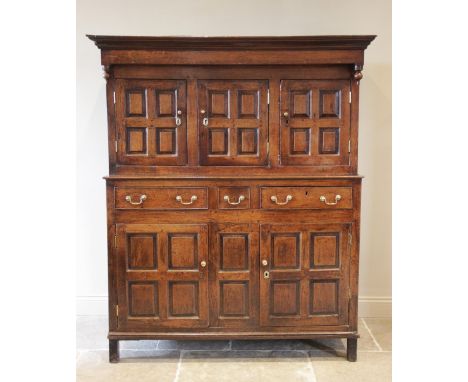 A mid 18th century oak deuddarn cwpwrdd, probably Cardiganshire, the moulded cornice above a plain frieze and hanging pendant