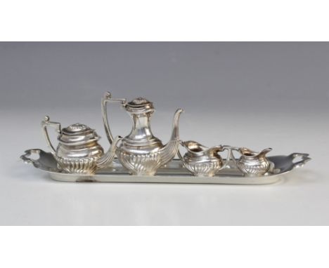 A miniature silver tea and coffee service by A Marston & Co, Birmingham 1973, comprising teapot, 3cm high, coffee pot, 4.4cm 