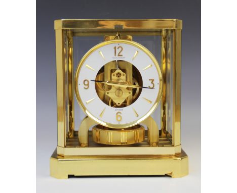A Jaeger-Le Coutre Atmos clock, serial number 310731, the white enamel bezel applied with gilt metal Arabic numerals punctuat