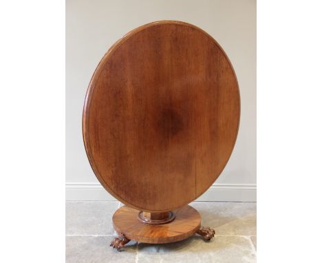 A mid 19th century mahogany centre table, the circular moulded tilt top raised upon an octagonal tapering pedestal and circul