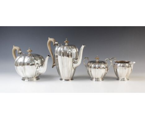 A four-piece silver tea service by Mappin &amp; Webb, Sheffield 1975, comprising teapot, hot water jug, sugar bowl and milk j