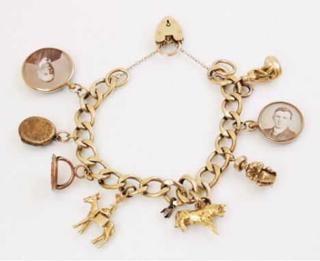 A 9ct gold curb-link charm bracelet with a heart-shaped padlock fastener, 18cm long, suspending an assortment of gold and yel