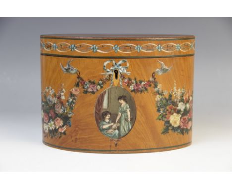 An Edwardian Sheraton revival satinwood tea caddy, of oval form, painted with floral swags and ribbons, with an oval miniatur