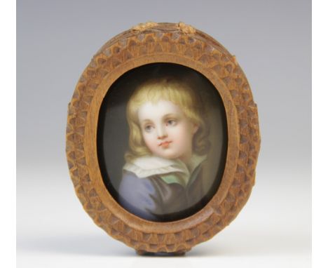 An Austrian portrait miniature on porcelain, 19th century, depicting a young child with lace collar, pencilled '394', '88' an