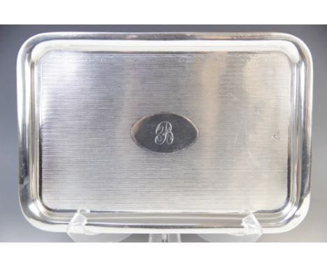 A George V silver card tray, Colen Hewer Cheshire, Chester 1913, of rounded rectangular form with engine turned decoration an