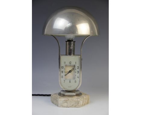 A Hungarian Art Deco clock lamp by Mofem, early 20th century, the lamp with nickel plated tilting domed shade, the clock with