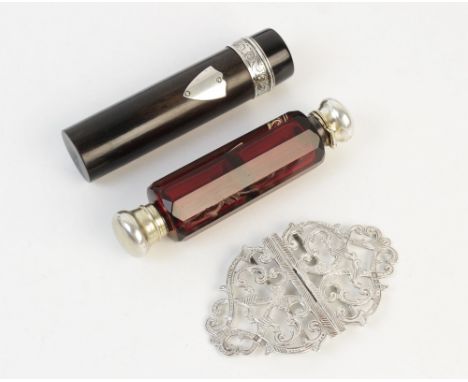 A Victorian ruby glass double-ended scent bottle, 10.6cm long, together with a silver nurses belt buckle, 8.2cm wide, and an 