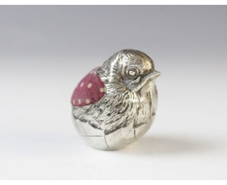 An Edwardian novelty silver pin cushion by Sampson Mordan &amp; Co, Sheffield 1906, in the form of a hatching chick with chas